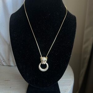 Jaguar with ring gold necklace